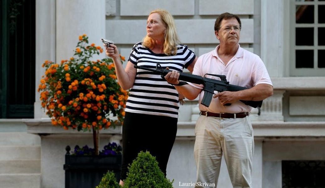 Was the St. Louis couple justified in brandishing firearms at protesters in front of their house? Was the St. Louis couple justified in brandishing firearms at protesters in front of their house?